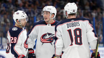 Apr 10, 2019; Tampa, FL, USA; Columbus Blue Jackets defenseman Zach Werenski (8), right wing Oliver Bjorkstrand (28) and center Pierre-Luc Dubois (18) talk during the second period of game one of the first round of the 2019 Stanley Cup Playoffs against the Tampa Bay Lightning at Amalie Arena. Mandatory Credit: Kim Klement-USA TODAY Sports