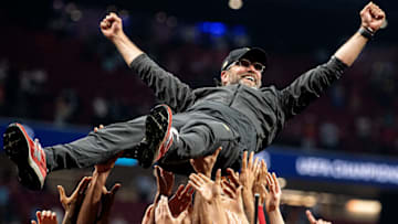 MADRID, SPAIN - JUNE 01: Jurgen Klopp, Manager of Liverpool is thrown in the air as he celebrates with his players and staff after winning the UEFA Champions League Final between Tottenham Hotspur and Liverpool at Estadio Wanda Metropolitano on June 01, 2019 in Madrid, Spain. (Photo by Matthias Hangst/Getty Images)