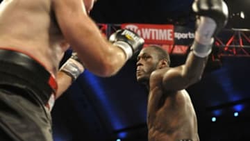 Oct 26, 2013; Atlantic City, NJ, USA; Deontay Wilder (bronze trunks) and Nicolai Firtha (black trunks) box during their WBA Continental Americas Heavyweight title bout at Boardwalk Hall. Wilder won via fourth round TKO Mandatory Credit: Joe Camporeale-USA TODAY Sports