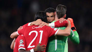 MANCHESTER, ENGLAND - SEPTEMBER 29: Cristiano Ronaldo of Manchester United celebrates their side's victory with Edinson Cavani and David De Gea after the UEFA Champions League group F match between Manchester United and Villarreal CF at Old Trafford on September 29, 2021 in Manchester, England. (Photo by Laurence Griffiths/Getty Images)