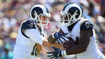 LOS ANGELES, CA - SEPTEMBER 23: Quarterback Jared Goff #16 of the Los Angeles Rams hands off to Todd Gurley #30 during the second quarter of the game against the Los Angeles Chargers at Los Angeles Memorial Coliseum on September 23, 2018 in Los Angeles, California. (Photo by Harry How/Getty Images)