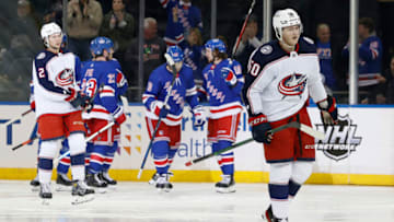 NEW YORK, NEW YORK - OCTOBER 29: Eric Robinson #50 of the Columbus Blue Jackets reacts as the New York Rangers celebrate a goal scored by Chris Kreider #20 during the third period at Madison Square Garden on October 29, 2021 in New York City. The Rangers won 4-0. (Photo by Sarah Stier/Getty Images)