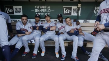 OAKLAND, CA - AUGUST 15: Jose Altuve #27, Yuli Gurriel #10, Aledmys Diaz #16, Yordan Alvarez #44 and Carlos Correa #1 of the Houston Astros sit in the dugout prior to the game against the Oakland Athletics at the Oakland-Alameda County Coliseum on August 15, 2019 in Oakland, California. The Athletics defeated the Astros 7-6. (Photo by Michael Zagaris/Oakland Athletics/Getty Images)