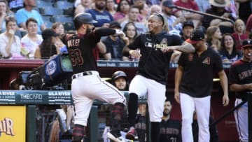PHOENIX, ARIZONA - SEPTEMBER 28: Christian Walker #53 of the Arizona Diamondbacks celebrates a solo home run with teammate Ketel Marte #4 in the second inning of the MLB game against the San Diego Padres at Chase Field on September 28, 2019 in Phoenix, Arizona. (Photo by Jennifer Stewart/Getty Images)