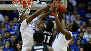 NEWARK, NJ - JANUARY 22: Alpha Diallo #11 of the Providence Friars battles Romaro Gill #35 and Tyrese Samuel #4 of the Seton Hall Pirates for a rebound during the second half of a college basketball game at Prudential Center on January 22, 2020 in Newark, New Jersey. Seton Hall defeated Providence 73-64. (Photo by Rich Schultz/Getty Images)