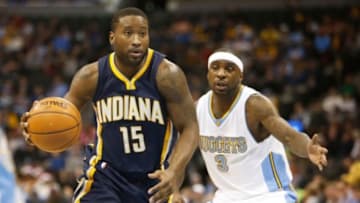 Dec 20, 2014; Denver, CO, USA; Indiana Pacers guard Donald Sloan (15) drives past Denver Nuggets guard Ty Lawson (3) during the game at Pepsi Center. Mandatory Credit: Chris Humphreys-USA TODAY Sports