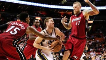 Dec 17, 2014; Miami, FL, USA; Utah Jazz forward Gordon Hayward (20) is defended by Miami Heat guard Mario Chalmers (15) and forward Chris Andersen (11) in the second half at American Airlines Arena. The Jazz won 105-87. Mandatory Credit: Robert Mayer-USA TODAY Sports