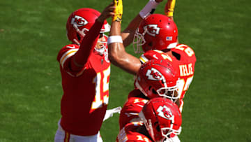 Patrick Mahomes #15 of the Kansas City Chiefs is congratulated by Travis Kelce #87 after scoring a touchdown (Photo by Jamie Squire/Getty Images)