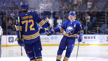 Apr 23, 2022; Buffalo, New York, USA; Buffalo Sabres defenseman Rasmus Dahlin (26) celebrates his goal with teammates during the second period against the New York Islanders at KeyBank Center. Mandatory Credit: Timothy T. Ludwig-USA TODAY Sports