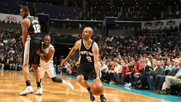 CHARLOTTE, NC - MARCH 21: Tony Parker #9 of the San Antonio Spurs dribbles the ball against the Charlotte Hornets on March 21, 2016 at Time Warner Cable Arena in Charlotte, North Carolina. NOTE TO USER: User expressly acknowledges and agrees that, by downloading and or using this photograph, User is consenting to the terms and conditions of the Getty Images License Agreement. Mandatory Copyright Notice: Copyright 2016 NBAE (Photo by Kent Smith/NBAE via Getty Images)
