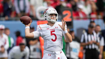 Sep 25, 2021; Chicago, Illinois, USA; Wisconsin Badgers quarterback Graham Mertz (5) passes during the second half against the Wisconsin Badgers at Soldier Field. Mandatory Credit: Patrick Gorski-USA TODAY Sports