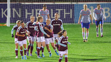 DAGENHAM, ENGLAND - MARCH 16: Grace Fisk of West Ham United celebrates after scoring their team's first goal with Adriana Leon during the Barclays FA Women's Super League match between West Ham United Women and Manchester United Women at Chigwell Construction Stadium on March 16, 2022 in Dagenham, England. (Photo by Jacques Feeney/Getty Images)