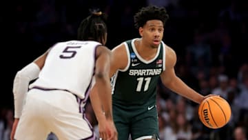 Mar 23, 2023; New York, NY, USA; Michigan State Spartans guard A.J. Hoggard (11) controls the ball against Kansas State Wildcats guard Cam Carter (5) during the second half at Madison Square Garden. Mandatory Credit: Brad Penner-USA TODAY Sports