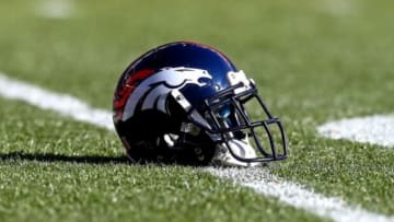 Jan 12, 2014; Denver, CO, USA; Detailed view of a Denver Broncos helmet on the field against the San Diego Chargers during the 2013 AFC divisional playoff football game at Sports Authority Field at Mile High. Mandatory Credit: Mark J. Rebilas-USA TODAY Sports