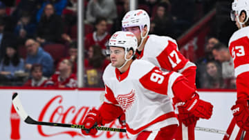 Dec 2, 2023; Montreal, Quebec, CAN; Detroit Red Wings right wing Alex DeBrincat (93) skates back to his bench after celebrating his goal against the Montreal Canadiens during the second period at Bell Centre. Mandatory Credit: David Kirouac-USA TODAY Sports
