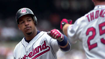 BALTIMORE, : Cleveland Indian batter Manny Ramirez (L) is greeted by teammate Jim Thome (R) after hitting his 12th career grand slam homerun off Baltimore Orioles pitcher Pat Rapp to give the Indians a 5-0 lead in the second inning 29 July 2000 at Camden Yards in Baltimore, MD. Ramirez got two homeruns and six RBIs in the Indians 14-3 victory. AFP PHOTO/HEATHER HALL (Photo credit should read HEATHER HALL/AFP via Getty Images)