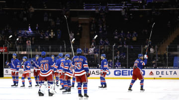 Mika Zibanejad #93 of the New York Rangers and the rest of his teammates celebrate the win (Credit: Elsa/Pool Photo-USA TODAY Sports)