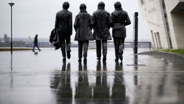 LIVERPOOL, UNITED KINGDOM - APRIL 28: The Beatles statue looks out over the River Mersey on a near deserted Pier Head during the rain which has helped the government's call to stay at home on April 28, 2020 in Liverpool, United Kingdom. British Prime Minister Boris Johnson, who returned to Downing Street this week after recovering from Covid-19, said the country needed to continue its lockdown measures to avoid a second spike in infections. (Photo by Christopher Furlong/Getty Images)