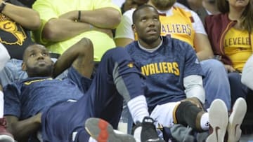 Oct 13, 2016; Cleveland, OH, USA; Cleveland Cavaliers forward LeBron James (left) and guard Kay Felder (20) watch the action in the third quarter against the Toronto Raptors at Quicken Loans Arena. Mandatory Credit: David Richard-USA TODAY Sports