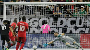 Héctor Herrera (#16) watches his shot in minute 90+8 get past Canada keeper Maxime Crépeau. (Photo by Bob Levey/Getty Images)