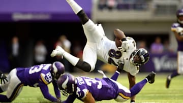 MINNEAPOLIS, MN - OCTOBER 22: Benjamin Watson #82 of the Baltimore Ravens is upended by Andrew Sendejo #34 of the Minnesota Vikings in the second quarter of the game on October 22, 2017 at U.S. Bank Stadium in Minneapolis, Minnesota. (Photo by Hannah Foslien/Getty Images)