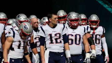 MIAMI, FL - DECEMBER 09: Tom Brady #12 of the New England Patriots and teammates prepare to take the field for their game against the Miami Dolphins at Hard Rock Stadium on December 9, 2018 in Miami, Florida. (Photo by Cliff Hawkins/Getty Images)
