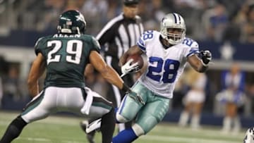 Dec 2, 2012; Arlington, TX, USA; Dallas Cowboys running back Felix Jones (28) runs the ball against Philadelphia Eagles safety Nate Allen (29) during the game at Cowboys Stadium. The Cowboys beat the Eagles 38-33. Mandatory Credit: Tim Heitman-USA TODAY Sports