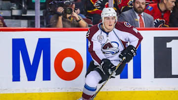 Mar 18, 2016; Calgary, Alberta, CAN; Colorado Avalanche defenseman Tyson Barrie (4) controls the puck against the Calgary Flames during the overtime period at Scotiabank Saddledome. Colorado Avalanche won 4-3. Mandatory Credit: Sergei Belski-USA TODAY Sports