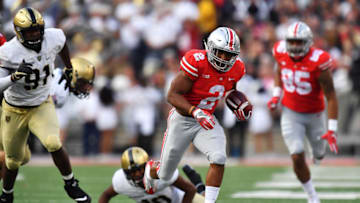 COLUMBUS, OH - SEPTEMBER 16: J.K. Dobbins #2 of the Ohio State Buckeyes breaks free from Wunmi Oyetuga #91 of the Army Golden Knights for a 52-yard touchdown run in the third quarter at Ohio Stadium on September 16, 2017 in Columbus, Ohio. Ohio State defeated Army 38-7. (Photo by Jamie Sabau/Getty Images)