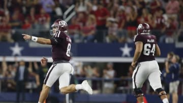 Sep 24, 2016; Dallas, TX, USA; Texas A&M Aggies quarterback Trevor Knight (8) points to the sidelines after throwing a touchdown pass in the third quarter against the Arkansas Razorbacks at AT&T Stadium. Mandatory Credit: Tim Heitman-USA TODAY Sports