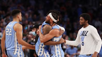 FORT WORTH, TEXAS - MARCH 19: North Carolina Tar Heels players react after defeating the Baylor Bears 93-86 in overtime during the second round of the 2022 NCAA Men's Basketball Tournament at Dickies Arena on March 19, 2022 in Fort Worth, Texas. (Photo by Ron Jenkins/Getty Images)