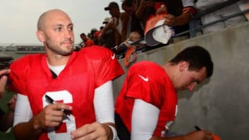 Aug 2, 2014; Akron, OH, USA; Cleveland Browns quarterback Brian Hoyer (6) and Johnny Manziel (2) sign autographs after training camp at InfoCision Stadium Summa Field. Mandatory Credit: Andrew Weber-USA TODAY Sports