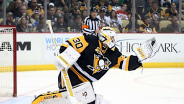 Mar 17, 2016; Pittsburgh, PA, USA; Pittsburgh Penguins goalie Matt Murray (30) makes a glove save against the Carolina Hurricanes during the first period at the CONSOL Energy Center. Mandatory Credit: Charles LeClaire-USA TODAY Sports
