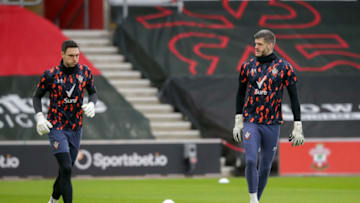 SOUTHAMPTON, ENGLAND - FEBRUARY 14: Alex McCarthy and Fraser Forster of Southampton during warm-up before the Premier League match between Southampton and Wolverhampton Wanderers at St Mary's Stadium on February 14, 2021 in Southampton, England. Sporting stadiums around the UK remain under strict restrictions due to the Coronavirus Pandemic as Government social distancing laws prohibit fans inside venues resulting in games being played behind closed doors. (Photo by Robin Jones/Getty Images)