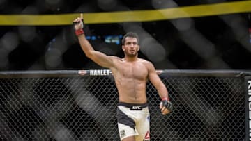 Jul 9, 2016; Las Vegas, NV, USA; Gegard Mousasi (red gloves) reacts after defeating Thiago Santos (blue gloves) during UFC 200 at T-Mobile Arena. Mandatory Credit: Joshua Dahl-USA TODAY Sports