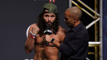 Apr 23, 2021; Jacksonville, Florida, USA; Jorge Masvidal (L) talks with UFC play-by-play commentator Jon Anik (R) during weigh-ins for UFC 261 at VyStar Veterans Memorial Arena. Mandatory Credit: Jasen Vinlove-USA TODAY Sports