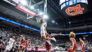 Auburn basketball center Dylan Cardwell (44) finishes an alley-op dunk at Auburn Arena in Auburn, Ala., on Tuesday, Feb. 1, 2022. Auburn Tigers lead Alabama Crimson Tide at halftime 51-37.