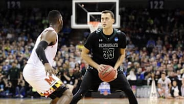 March 20, 2016; Spokane , WA, USA; Hawaii Rainbow Warriors forward Stefan Jankovic (33) controls the ball against Maryland Terrapins center Diamond Stone (33) during the first half in the second round of the 2016 NCAA Tournament at Spokane Veterans Memorial Arena. Mandatory Credit: James Snook-USA TODAY Sports