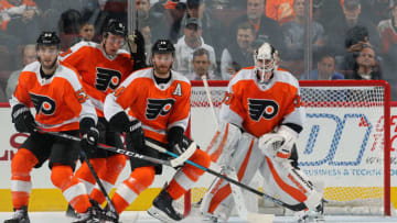 PHILADELPHIA, PA - OCTOBER 16: Shayne Gostisbehere #53, Ivan Provorov #9, Sean Couturier #14 and Cal Pickard #33 of the Philadelphia Flyers defend their goal against the Florida Panthers on October 16, 2018 at the Wells Fargo Center in Philadelphia, Pennsylvania. (Photo by Len Redkoles/NHLI via Getty Images)