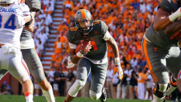 Sep 24, 2016; Knoxville, TN, USA; Tennessee Volunteers quarterback Joshua Dobbs (11) runs the ball against the Florida Gators during the second quarter at Neyland Stadium. Mandatory Credit: Randy Sartin-USA TODAY Sports