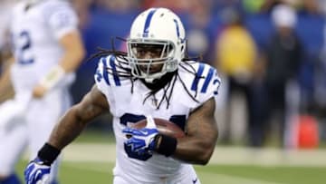 Aug 16, 2014; Indianapolis, IN, USA; Indianapolis Colts running back Trent Richardson (34) runs with the ball against the New York Giants at Lucas Oil Stadium. Mandatory Credit: Brian Spurlock-USA TODAY Sports