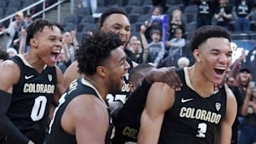 LAS VEGAS, NEVADA - NOVEMBER 26: Tyler Bey (R) #1 of the Colorado Buffaloes is mobbed by teammates as he is announced as the tournament MVP after the team's 71-67 victory over the Clemson Tigers to win the MGM Resorts Main Event basketball tournament at T-Mobile Arena on November 26, 2019 in Las Vegas, Nevada. (Photo by Ethan Miller/Getty Images)