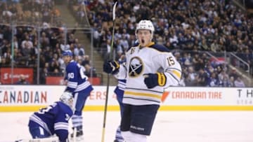Mar 7, 2016; Toronto, Ontario, CAN; Buffalo Sabres center Jack Eichel (15) celebrates his goal in the third period against the Toronto Maple Leafs at Air Canada Centre. The Sabres beat the Maple Leafs 4-3 in a shootout. Mandatory Credit: Tom Szczerbowski-USA TODAY Sports
