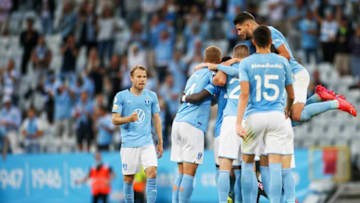 Malmo's Danish midfielder Anders Christiansen (unseen) is celebrated by teammates for scoring 2-1 during the UEFA Champions League qualifying football match between Malmo and HJK Helsinki at the Eleda stadium in Malmo, Sweden on July 21, 2021. - Sweden OUT (Photo by Anders Bjuro / TT News Agency / AFP) / Sweden OUT (Photo by ANDERS BJURO/TT News Agency/AFP via Getty Images)