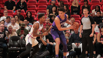 MIAMI, FL - MARCH 5: Devin Booker #1 of the Phoenix Suns handles the ball against Rodney McGruder #17 of the Miami Heaton March 5, 2018 at American Airlines Arena in Miami, Florida. NOTE TO USER: User expressly acknowledges and agrees that, by downloading and or using this Photograph, user is consenting to the terms and conditions of the Getty Images License Agreement. Mandatory Copyright Notice: Copyright 2018 NBAE (Photo by Oscar Baldizon/NBAE via Getty Images)