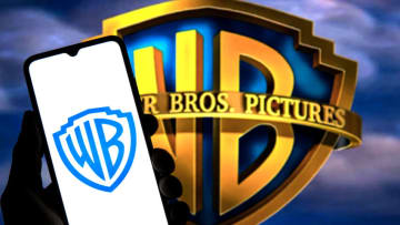 SPAIN - 2022/03/11: In this photo illustration a Warner Bros. Entertainment Inc. logo seen displayed on a smartphone with a Warner Bros. Entertainment Inc logo in the background. (Photo Illustration by Thiago Prudencio/SOPA Images/LightRocket via Getty Images)