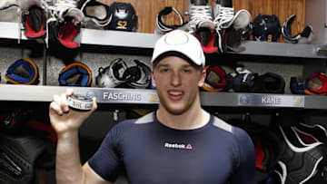 Mar 26, 2016; Buffalo, NY, USA; Buffalo Sabres right wing Hudson Fasching (52) holds the puck from his first career NHL goal against the Winnipeg Jets at First Niagara Center. Buffalo beats Winnipeg 3 to 2. Mandatory Credit: Timothy T. Ludwig-USA TODAY Sports