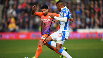 HUDDERSFIELD, ENGLAND - FEBRUARY 18: Sergio Aguero of Manchester City (L) and Collin Quaner of Huddersield Town (R) battle for possession during The Emirates FA Cup Fifth Round match between Huddersfield Town and Manchester City at John Smith's Stadium on February 18, 2017 in Huddersfield, England. (Photo by Laurence Griffiths/Getty Images)