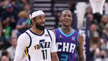 Dec 20, 2021; Salt Lake City, Utah, USA; Utah Jazz guard Mike Conley (11) and Charlotte Hornets guard Terry Rozier (3) react to a play in the fourth quarter at Vivint Arena. Mandatory Credit: Rob Gray-USA TODAY Sports