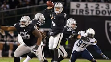 Dec 24, 2015; Oakland, CA, USA; Oakland Raiders quarterback Derek Carr (4) throws the ball against the San Diego Chargers during the first quarter at O.co Coliseum. Mandatory Credit: Kelley L Cox-USA TODAY Sports